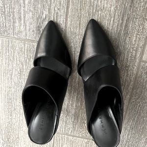 Cute black leather sandals/heels. Closed toe. Open back.